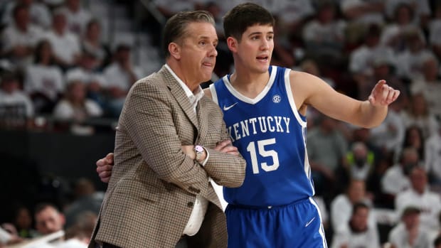 Feb 27, 2024; Starkville, Mississippi, USA; Kentucky Wildcats guard Reed Sheppard (15) talks with head coach John Calipari (left) during the second half against the Mississippi State Bulldogs at Humphrey Coliseum. Mandatory Credit: Petre Thomas-USA TODAY Sports
